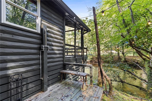 view of side of property with a wooden deck