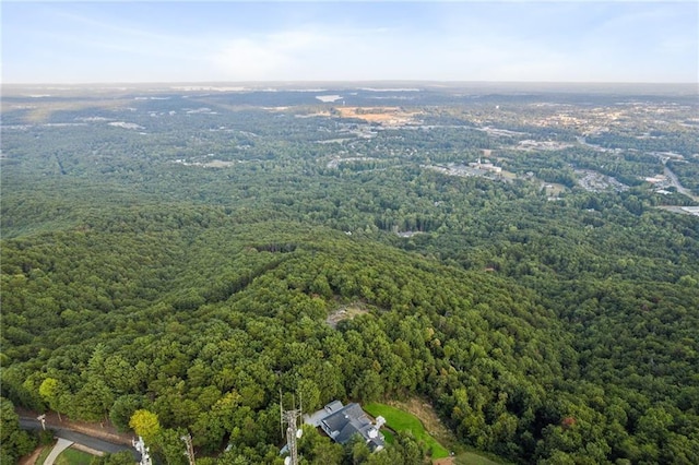 bird's eye view featuring a wooded view