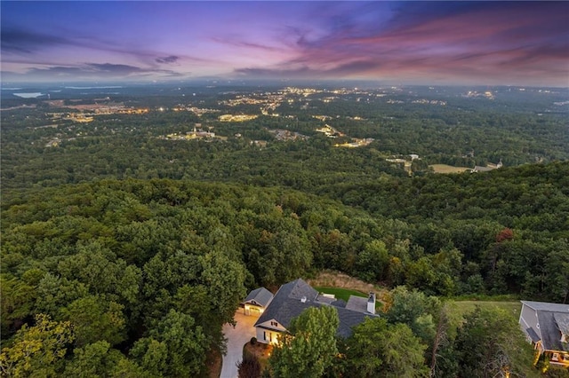 drone / aerial view featuring a view of trees