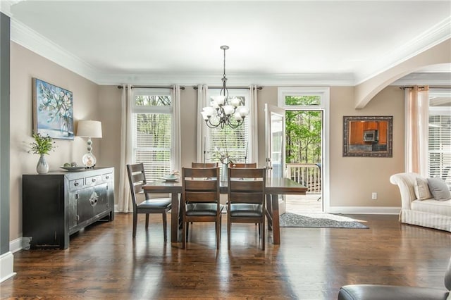 107 Estates At The Lake Dr, Canton, GA 30114 - dining room featuring a chandelier, arched walkways, crown molding, and plenty of natural light