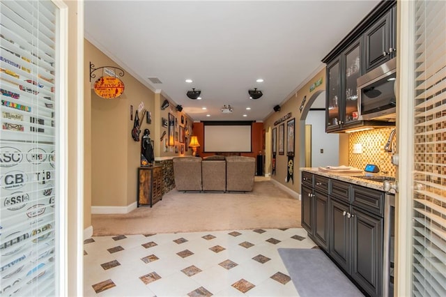 107 Estates At The Lake Dr, Canton, GA 30114 - interior space with stainless steel microwave, arched walkways, baseboards, and crown molding