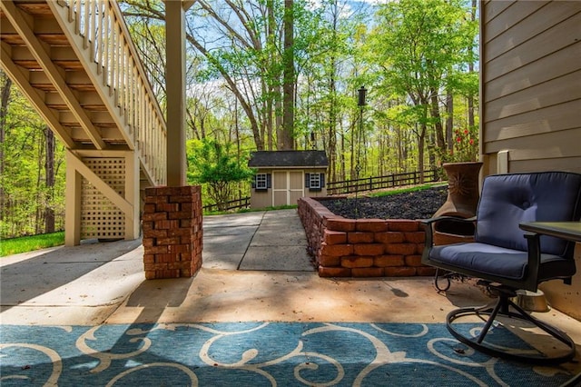 107 Estates At The Lake Dr, Canton, GA 30114 - view of patio with an outbuilding, fence, and stairs