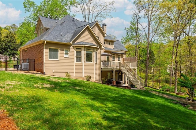 107 Estates At The Lake Dr, Canton, GA 30114 - back of property with stairs, central AC, a wooden deck, fence, and a lawn