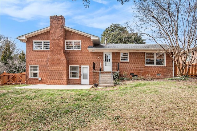 view of front of home featuring a chimney, crawl space, fence, a patio area, and brick siding