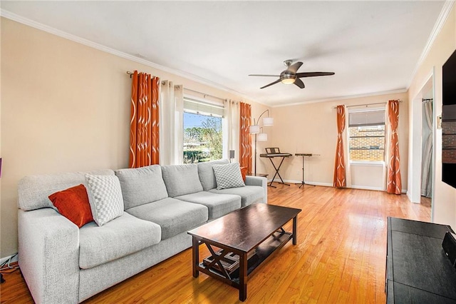 living room featuring ornamental molding, ceiling fan, and hardwood / wood-style floors