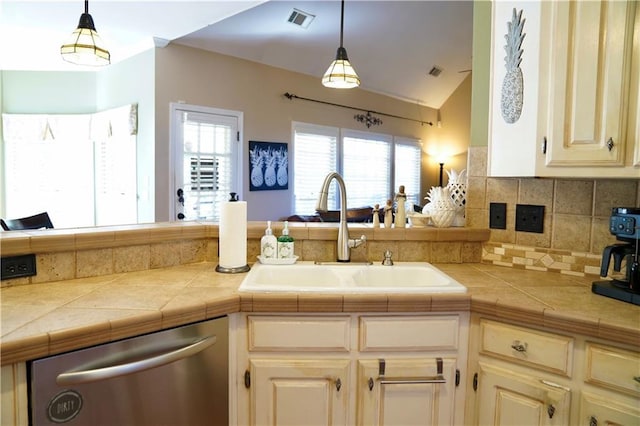 kitchen featuring visible vents, a sink, decorative light fixtures, decorative backsplash, and dishwasher