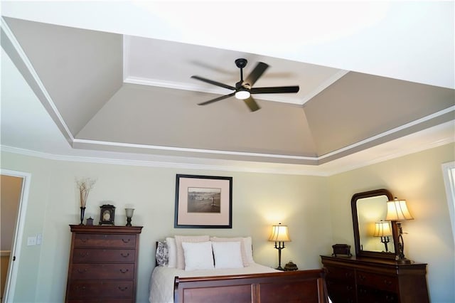 bedroom with vaulted ceiling, a ceiling fan, and ornamental molding