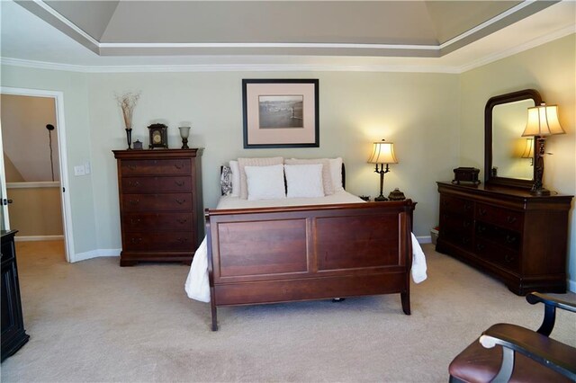 bedroom featuring crown molding, baseboards, a raised ceiling, and light carpet