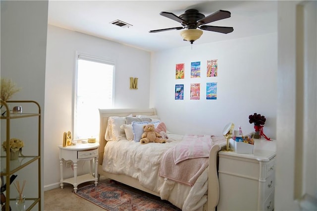 bedroom featuring visible vents, carpet floors, and ceiling fan