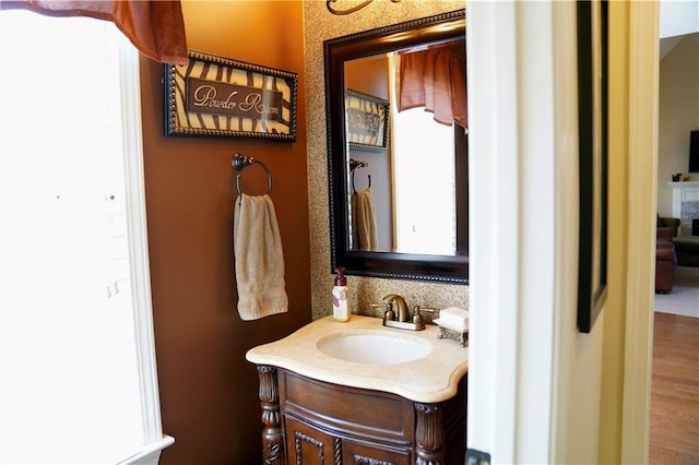 bathroom with a healthy amount of sunlight and vanity