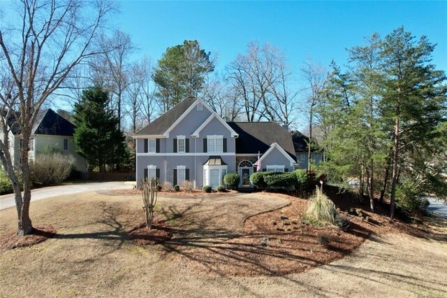 view of front of house featuring stucco siding and driveway