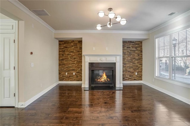 unfurnished living room with crown molding, dark hardwood / wood-style floors, and a notable chandelier