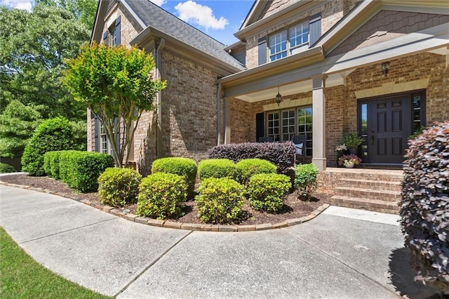 2660 Burnt Hickory Dr, Cumming, GA 30028 - view of exterior entry featuring brick siding and covered porch