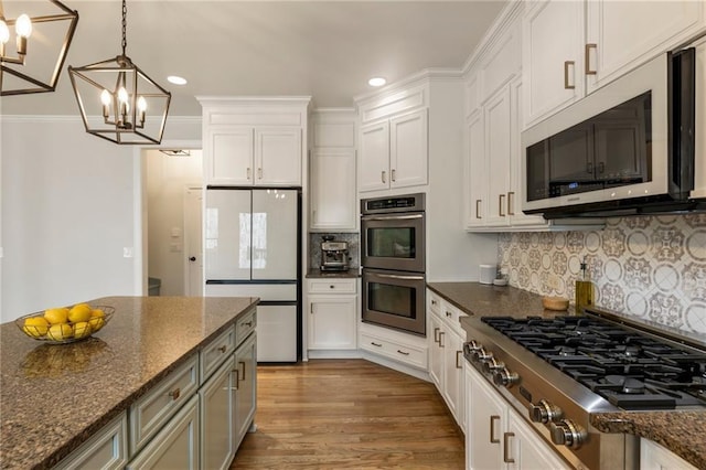 2660 Burnt Hickory Dr, Cumming, GA 30028 - kitchen featuring appliances with stainless steel finishes, a chandelier, recessed lighting, white cabinets, and hanging light fixtures