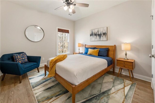 2660 Burnt Hickory Dr, Cumming, GA 30028 - bedroom with baseboards, light wood-style flooring, and a ceiling fan