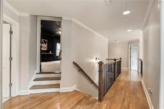 2660 Burnt Hickory Dr, Cumming, GA 30028 - hall with wood finished floors, an upstairs landing, recessed lighting, ornamental molding, and baseboards