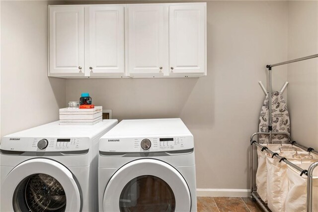 2660 Burnt Hickory Dr, Cumming, GA 30028 - laundry room featuring washer and clothes dryer, cabinet space, and baseboards