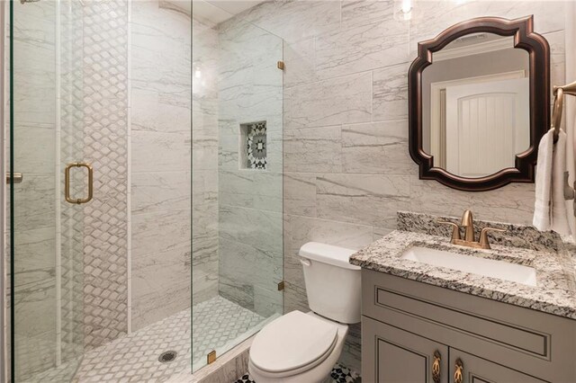 2660 Burnt Hickory Dr, Cumming, GA 30028 - bathroom featuring a shower stall, toilet, tile walls, and vanity