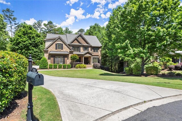 2660 Burnt Hickory Dr, Cumming, GA 30028 - view of front facade with stone siding and a front yard