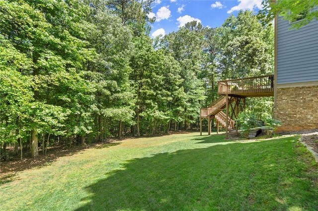 2660 Burnt Hickory Dr, Cumming, GA 30028 - view of grassy yard featuring stairs and a wooden deck
