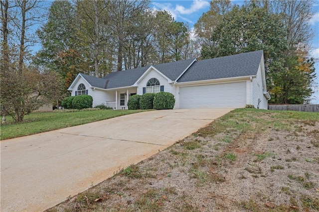 single story home featuring a front lawn and a garage