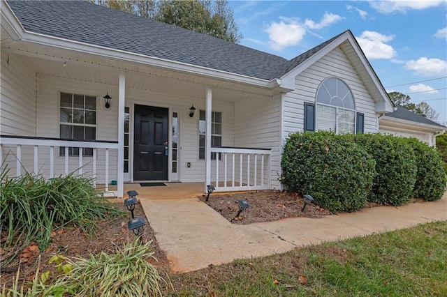 property entrance with covered porch