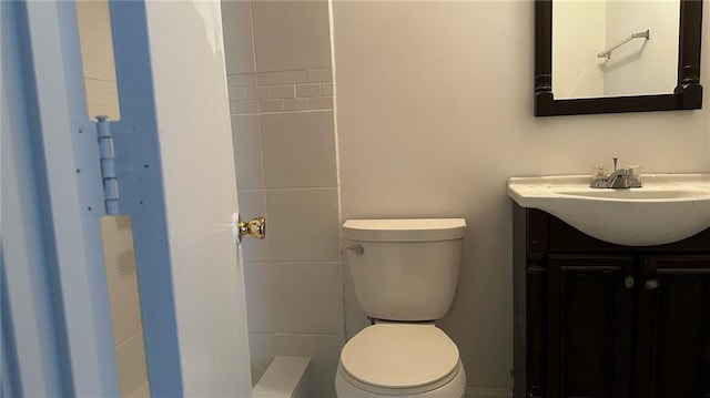 full bath featuring toilet and vanity