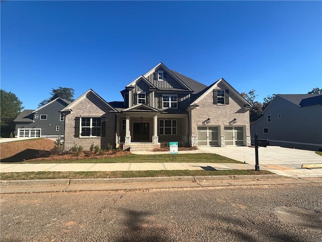 craftsman-style house featuring covered porch and a garage