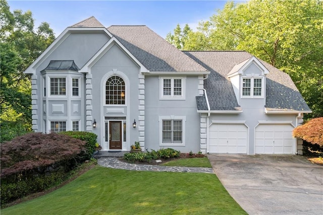 3525 Stone Cliff Way, Woodstock, GA 30189 - view of front of house featuring concrete driveway, stucco siding, a front yard, a garage, and roof with shingles