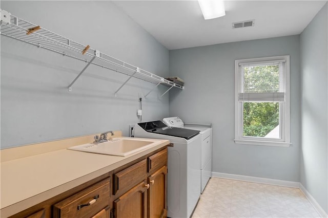 3525 Stone Cliff Way, Woodstock, GA 30189 - washroom featuring washer and dryer, baseboards, cabinet space, and light flooring