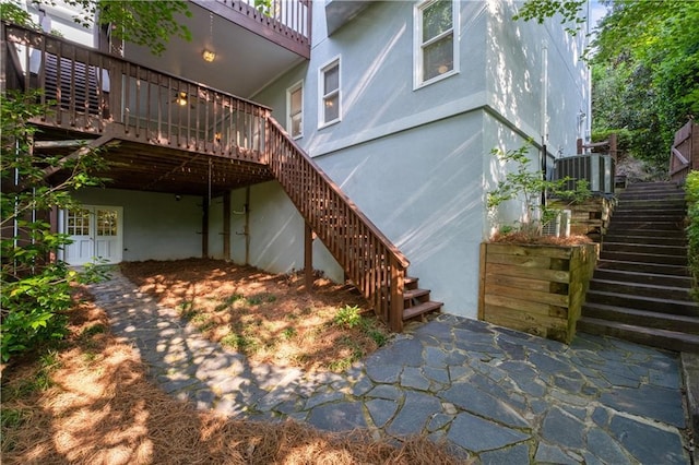 3525 Stone Cliff Way, Woodstock, GA 30189 - view of home's exterior featuring stairway, central air condition unit, and a wooden deck