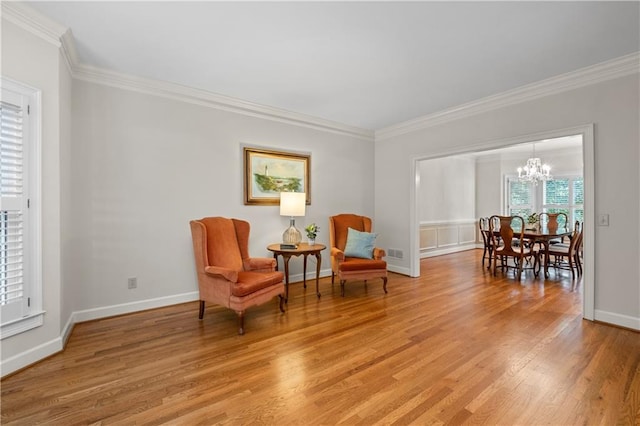 3525 Stone Cliff Way, Woodstock, GA 30189 - living area featuring ornamental molding, a chandelier, light wood-style floors, and baseboards