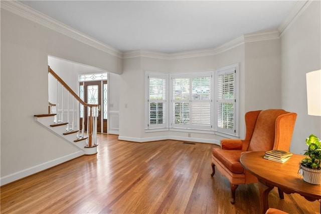 3525 Stone Cliff Way, Woodstock, GA 30189 - sitting room with light wood finished floors, crown molding, stairway, and baseboards