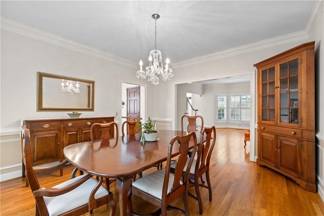 3525 Stone Cliff Way, Woodstock, GA 30189 - dining space featuring a chandelier, crown molding, and light wood-type flooring
