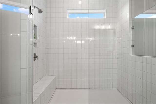 bathroom with a shower stall