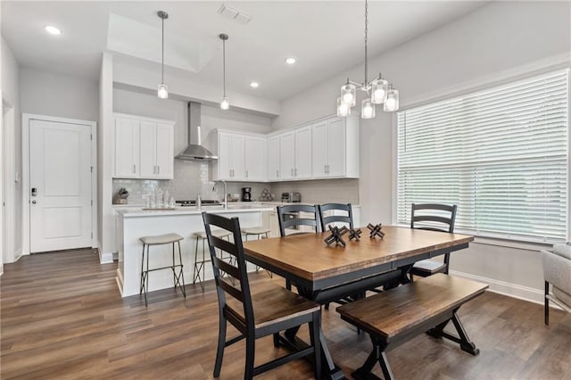 dining area featuring visible vents, recessed lighting, and dark wood finished floors