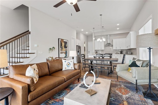 living room featuring recessed lighting, stairs, ceiling fan, and wood finished floors