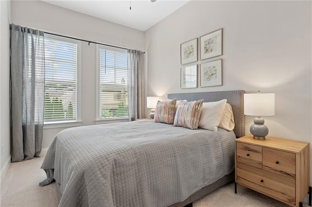 carpeted bedroom featuring baseboards