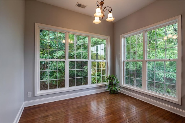 interior space featuring a wealth of natural light and an inviting chandelier