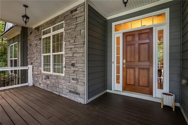 doorway to property with a porch