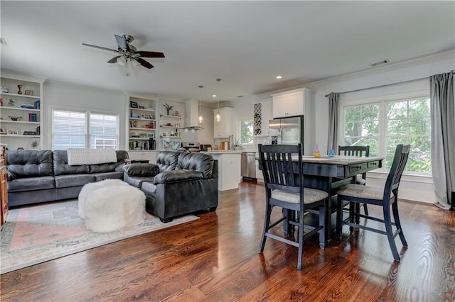 2972 Lookout Pl NE, Atlanta, GA 30305 - dining area with ornamental molding, plenty of natural light, a ceiling fan, dark wood-style floors, and recessed lighting