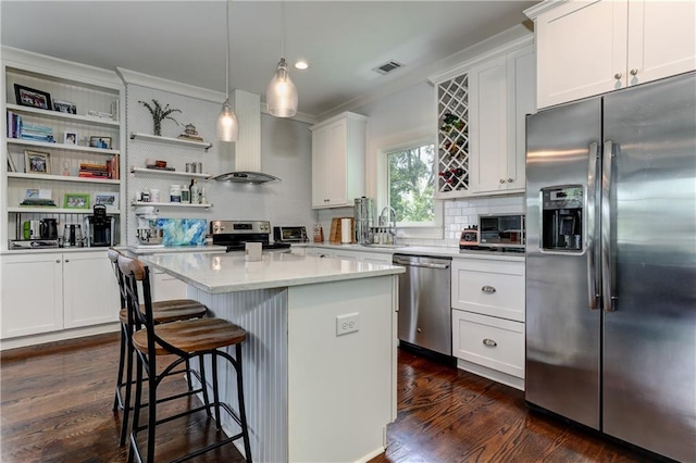 2972 Lookout Pl NE, Atlanta, GA 30305 - kitchen featuring stainless steel appliances, ventilation hood, ornamental molding, dark wood-style flooring, and tasteful backsplash