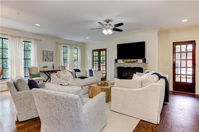 2972 Lookout Pl NE, Atlanta, GA 30305 - living area with healthy amount of natural light, ornamental molding, a glass covered fireplace, dark wood-type flooring, and recessed lighting