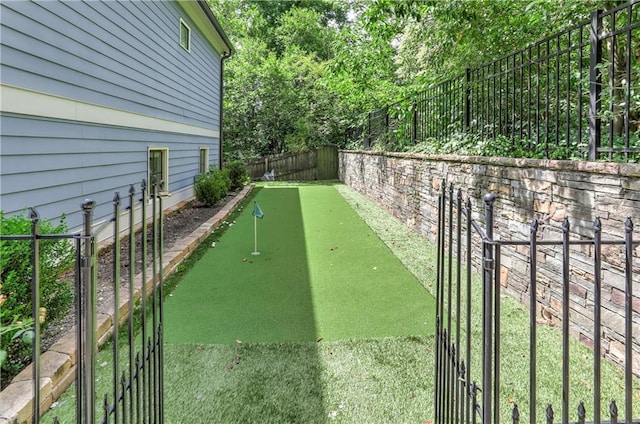 2972 Lookout Pl NE, Atlanta, GA 30305 - view of property's community with a putting area and a fenced backyard