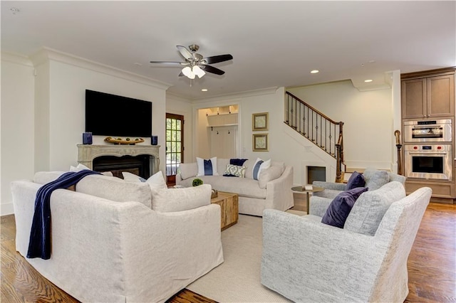 2972 Lookout Pl NE, Atlanta, GA 30305 - living room featuring stairs, a fireplace, a ceiling fan, light wood finished floors, and recessed lighting