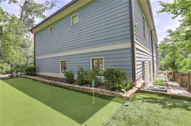 2972 Lookout Pl NE, Atlanta, GA 30305 - view of side of property featuring an area to practice putting and a cooling unit