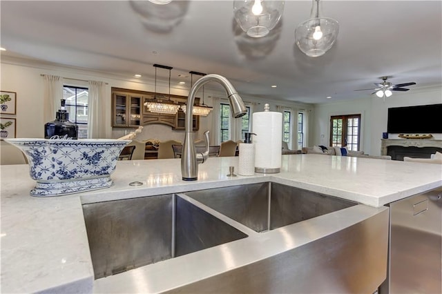 2972 Lookout Pl NE, Atlanta, GA 30305 - kitchen featuring decorative light fixtures, light stone countertops, open floor plan, stainless steel dishwasher, and ceiling fan