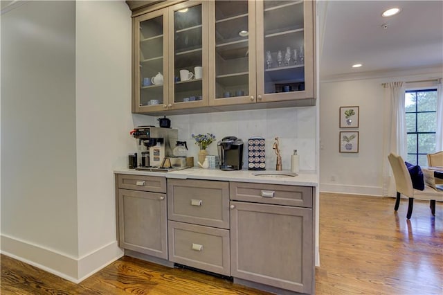 2972 Lookout Pl NE, Atlanta, GA 30305 - bar area with wood finished floors, tasteful backsplash, and recessed lighting
