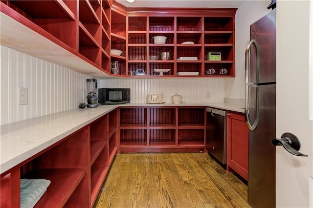 2972 Lookout Pl NE, Atlanta, GA 30305 - kitchen with open shelves, stainless steel appliances, wood finished floors, dark brown cabinets, and light countertops