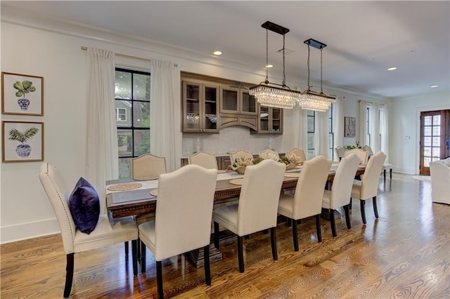 2972 Lookout Pl NE, Atlanta, GA 30305 - dining space with wood finished floors, ornamental molding, and recessed lighting